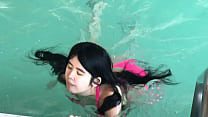 Instead, The Beautiful Chinese Woman Swims In A Hotel Pool